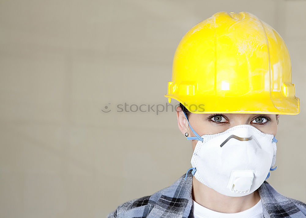 Similar – Workman in protective mask and glasses standing on street