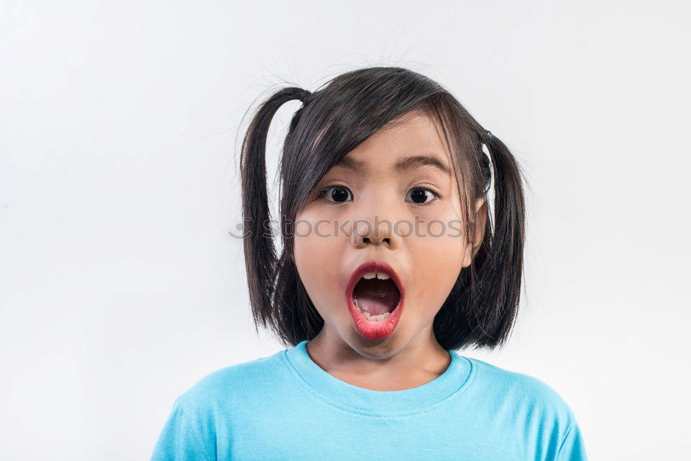 Similar – portrait of angry girl on blue background