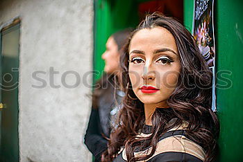 Similar – Woman in red coat with mobile phone in hands, smartphone, urban scene