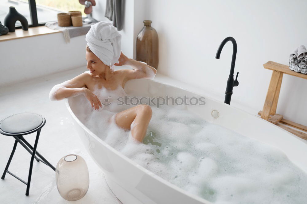 Similar – Woman lying in tub doing hydrotherapy treatment