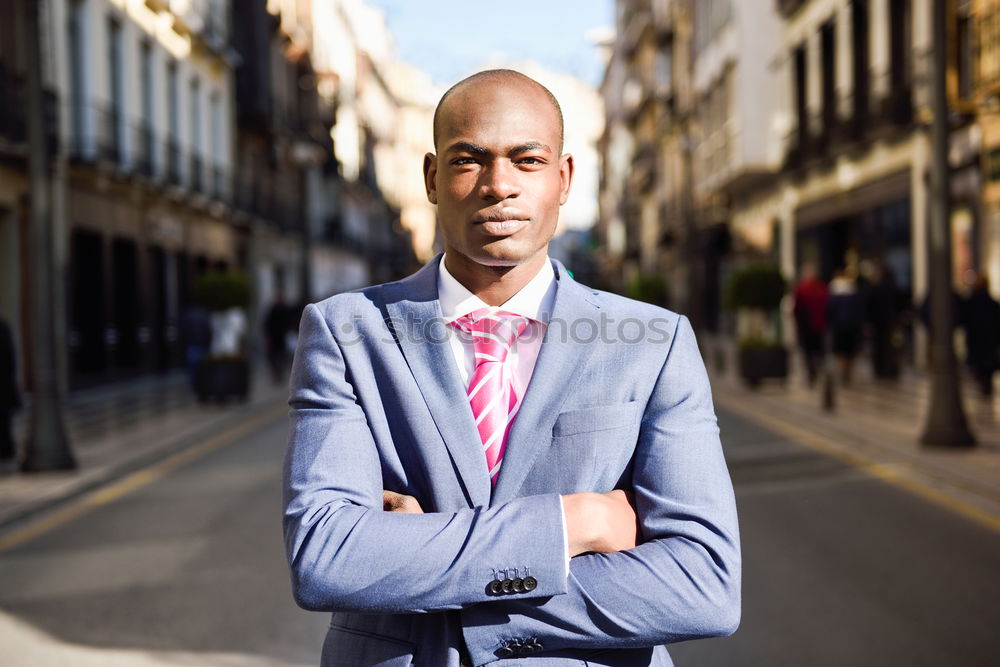 Similar – Handsome black man wearing suit in urban background