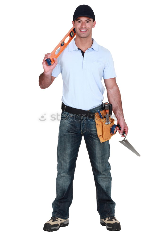 Similar – Worker man with hammer drill and building level at construction site