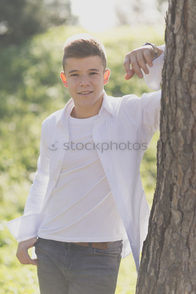 Similar – Image, Stock Photo Attractive teenager guy in a park