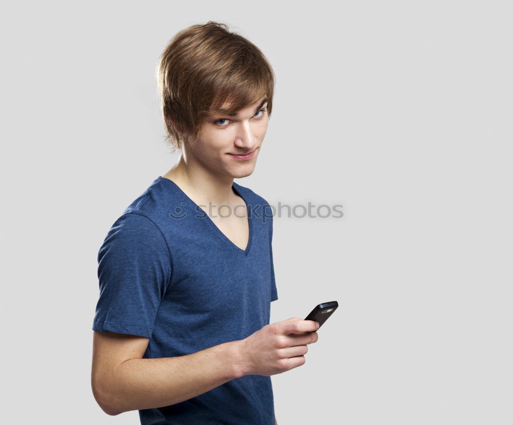 Similar – Man using his mobile phone.