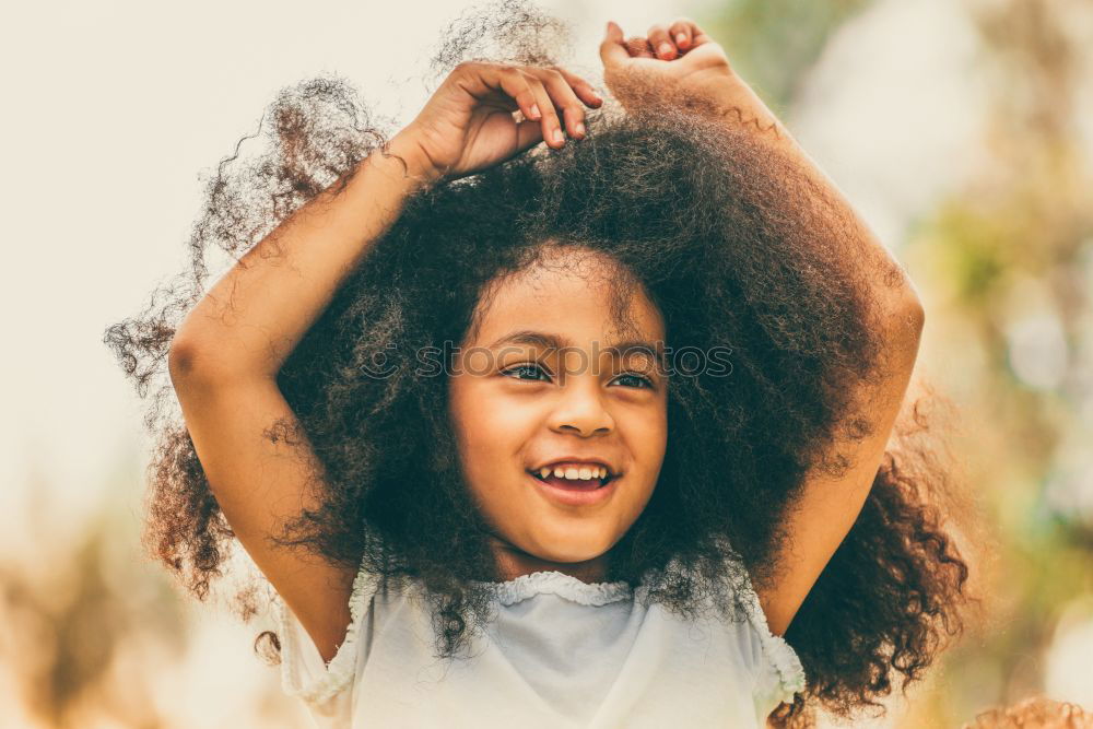 Similar – Image, Stock Photo African woman, afro hairstyle, sitting on a wall.