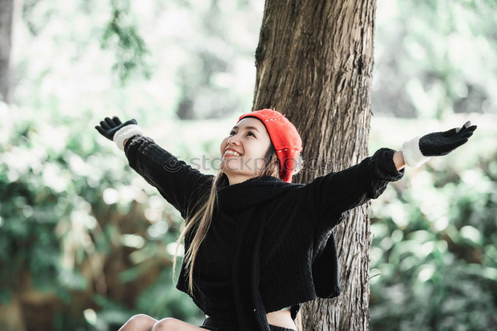 Similar – Image, Stock Photo Young black beautiful woman lying on peaces of wood near the royal palace in Madrid during winter