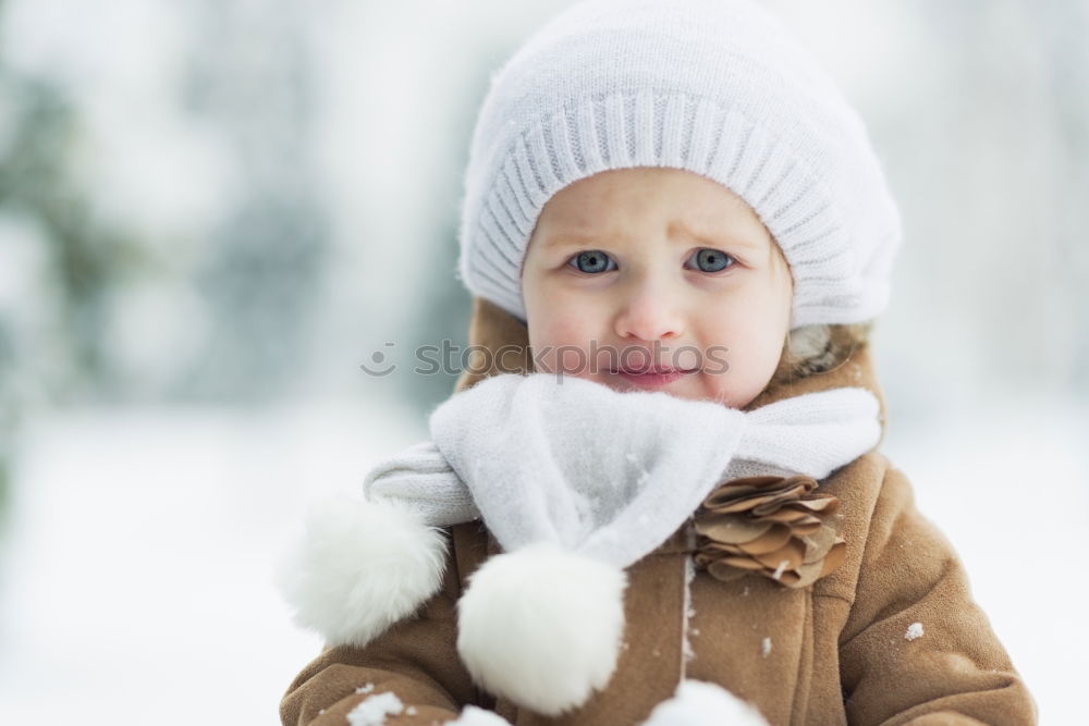 Similar – Image, Stock Photo Happy little girl enjoying snow. Child playing outdoors walking through deep snow in wintertime while snow falling. Toddler is wearing dark blue snowsuit