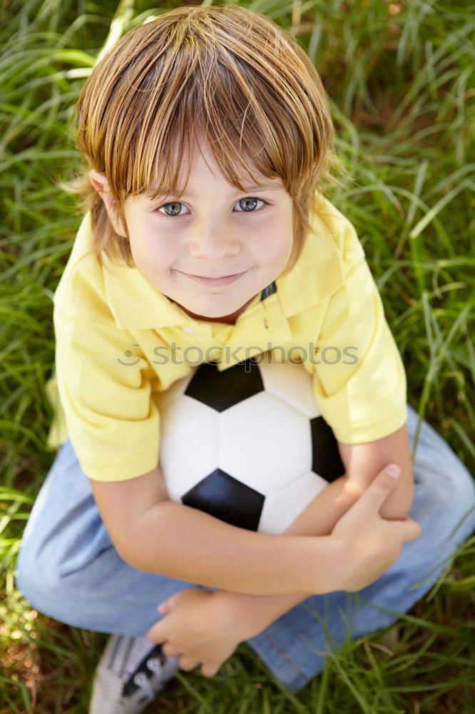 Portrait of a young boy with soccer ball. Concept of sport.