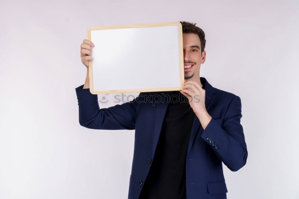 Portrait of a man showing a blank card.