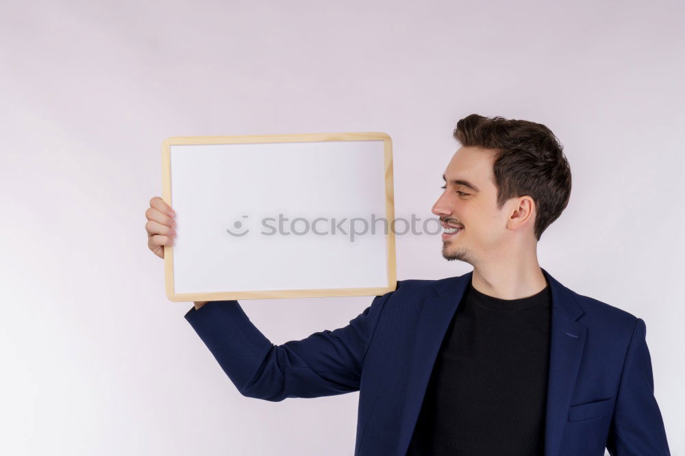 Similar – Portrait of a man showing a blank card.