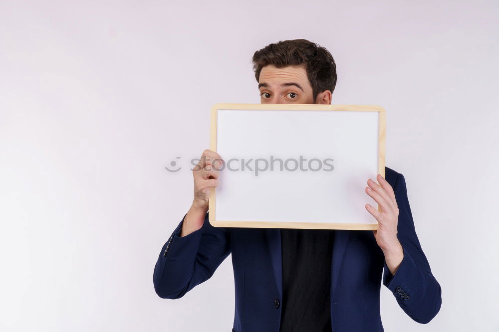 Similar – Portrait of a man showing a blank card.