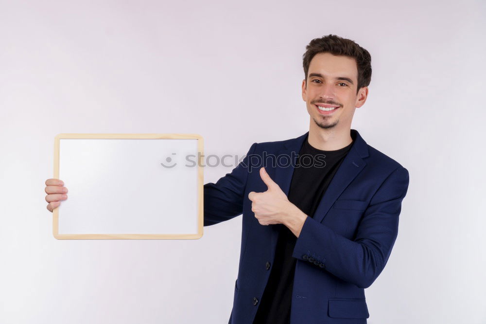 Similar – Portrait of a man showing a blank card.