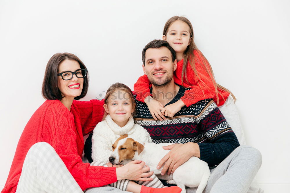 Similar – Mature couple relaxed at home in bed with their four little daughters and the Dog