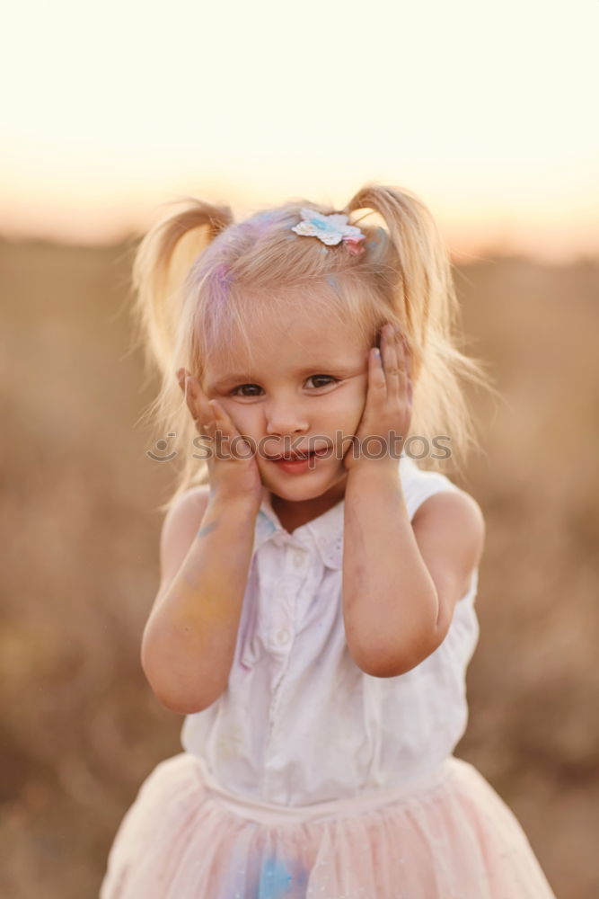 Similar – Little girl putting on her socks