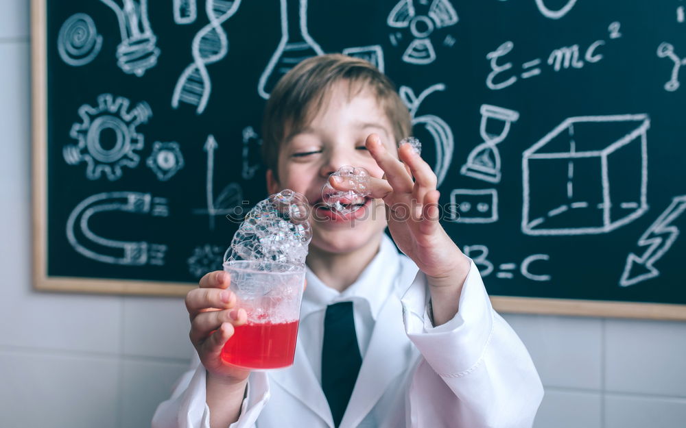 Similar – Child dressed as a scientist and chalkboard