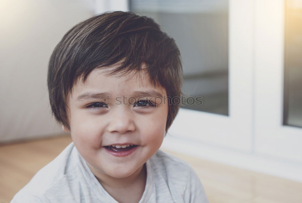 close up portrait of cute happy child boy