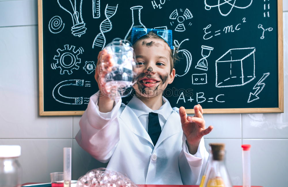 Similar – Child dressed as a scientist and chalkboard