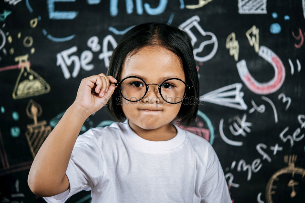 Similar – Image, Stock Photo Cute schoolgirl posing in a classroom