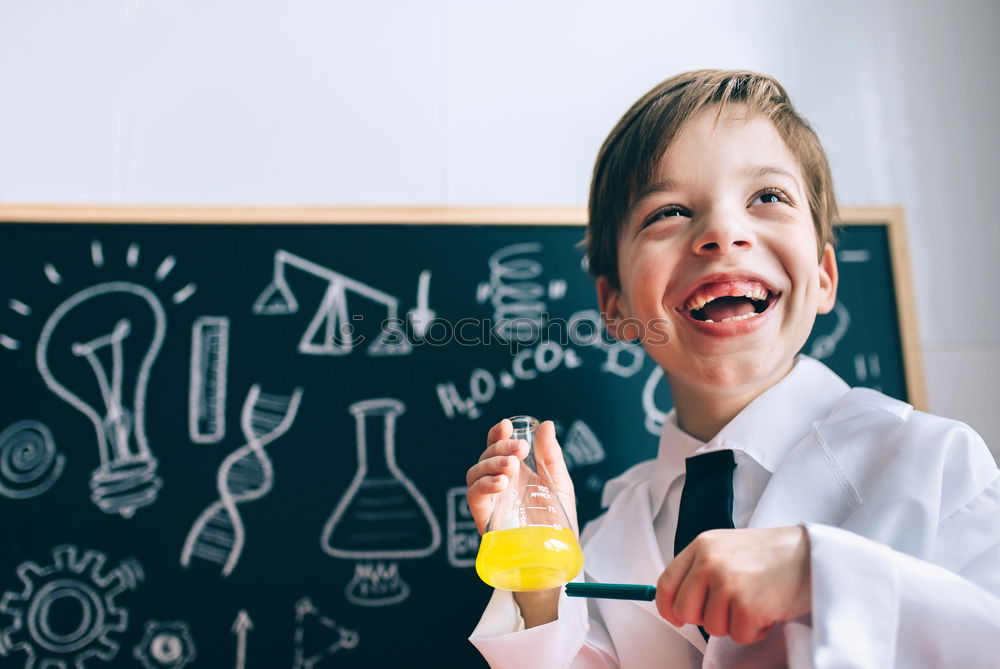 Similar – Child dressed as a scientist and chalkboard