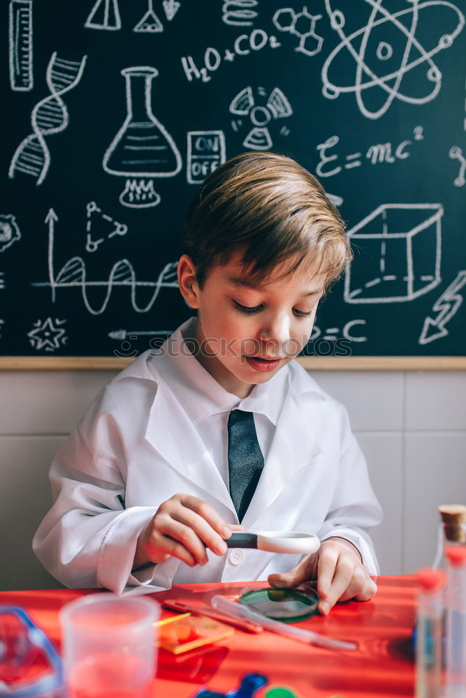 Similar – Image, Stock Photo Boy playing with chemistry game