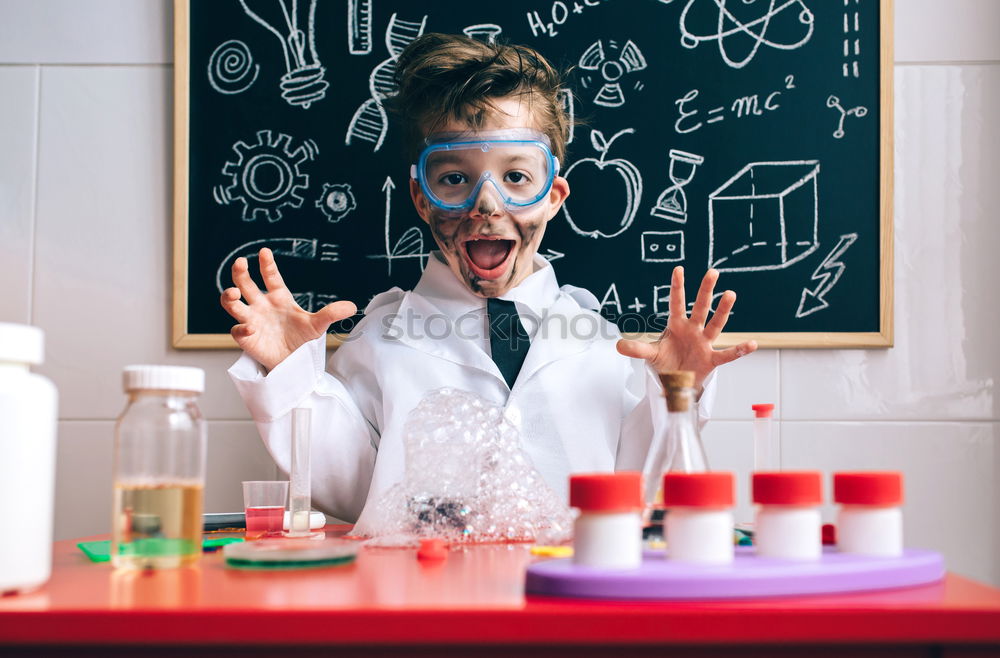 Similar – Image, Stock Photo Boy dressed as chemist with dirty face after doing an experiment