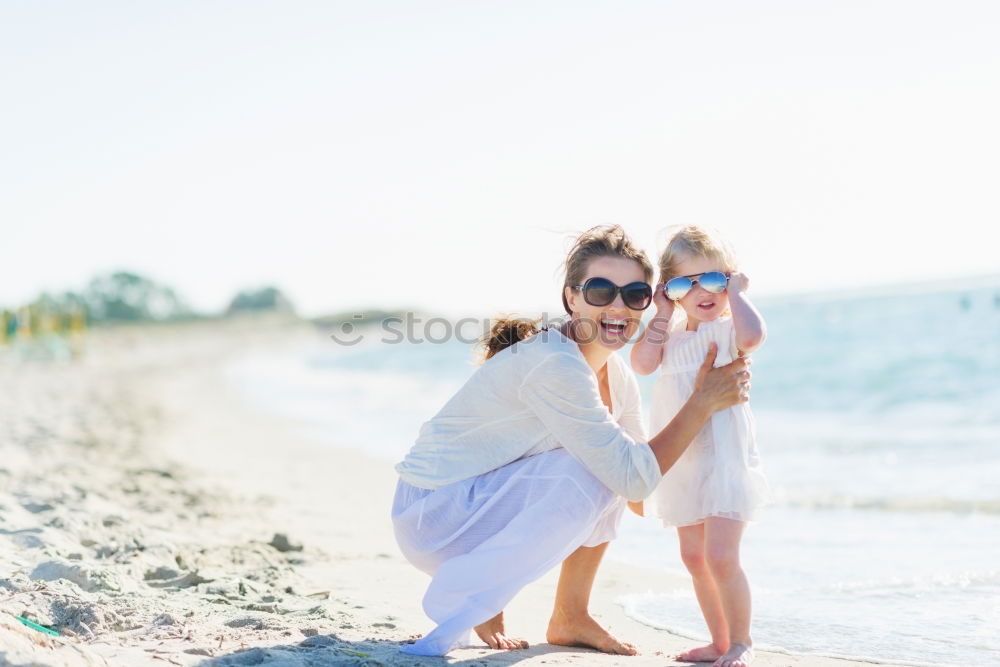 Similar – Image, Stock Photo Two happy children standing on the beach at the day time. Concept of friendly family.