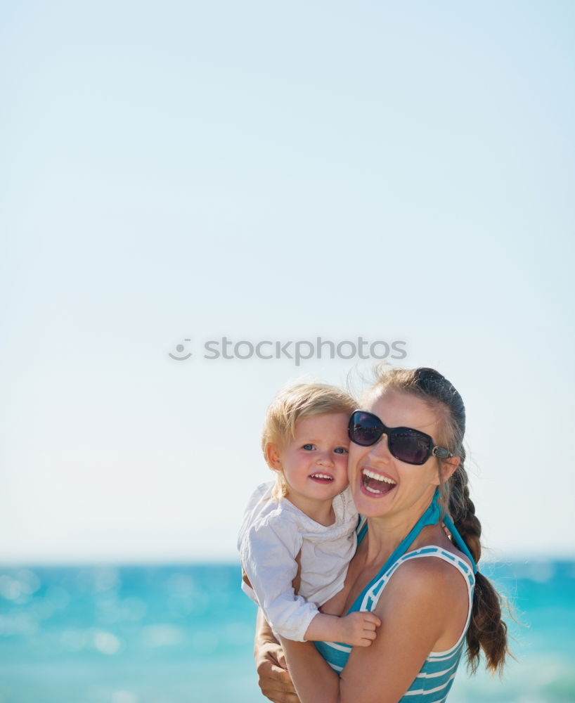 Similar – Image, Stock Photo Sister and brother playing on the beach at the day time.