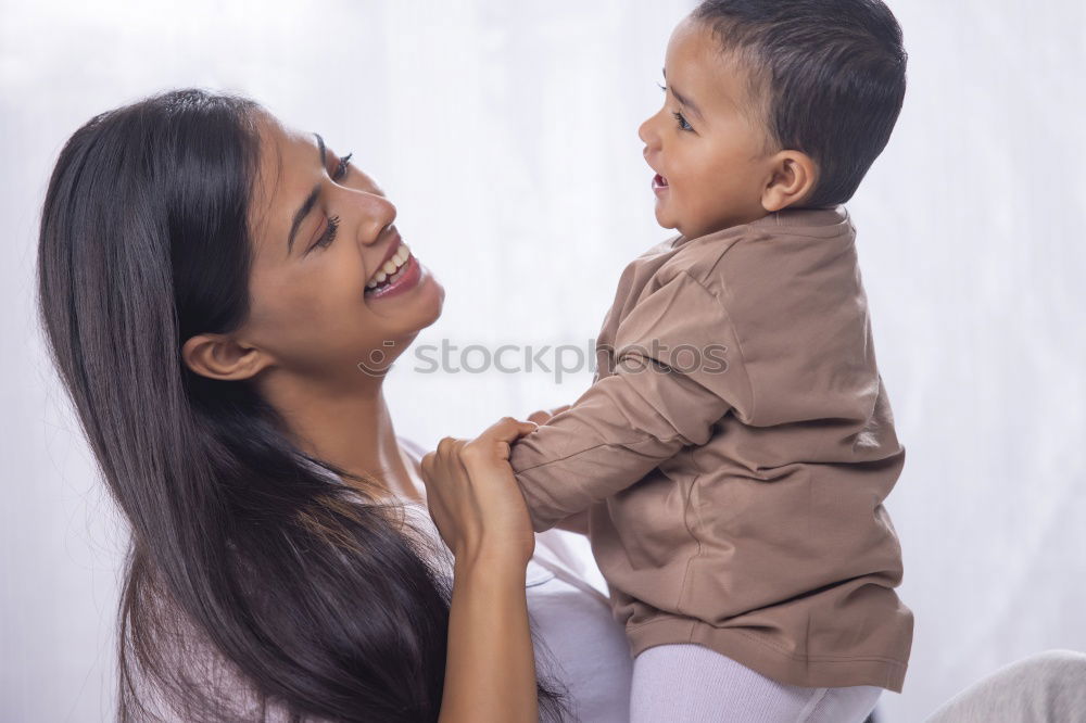 Similar – mother kissing little baby at bar terrace