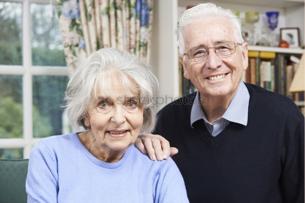 Similar – Smiling senior couple looks lovingly into each other’s eyes