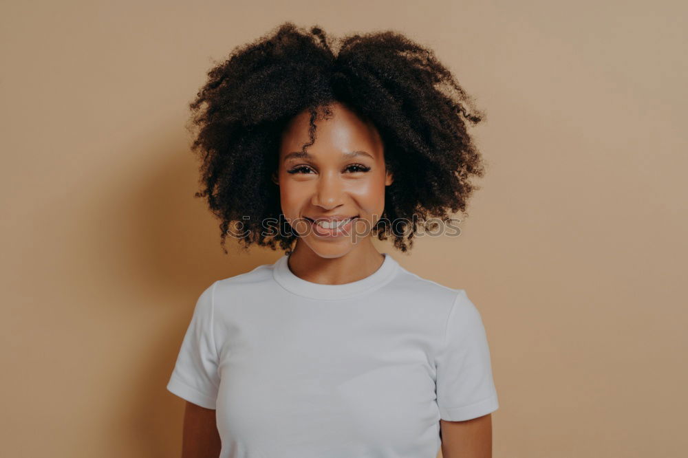 Similar – close up of a pretty black woman with curly hair smiling and lying on bed looking away