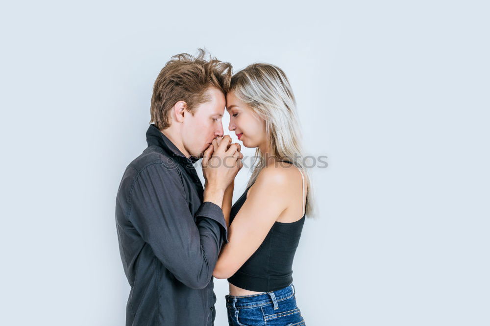 Similar – Image, Stock Photo Blonde woman and bearded man embracing and smiling together with a van in the background at sunset.