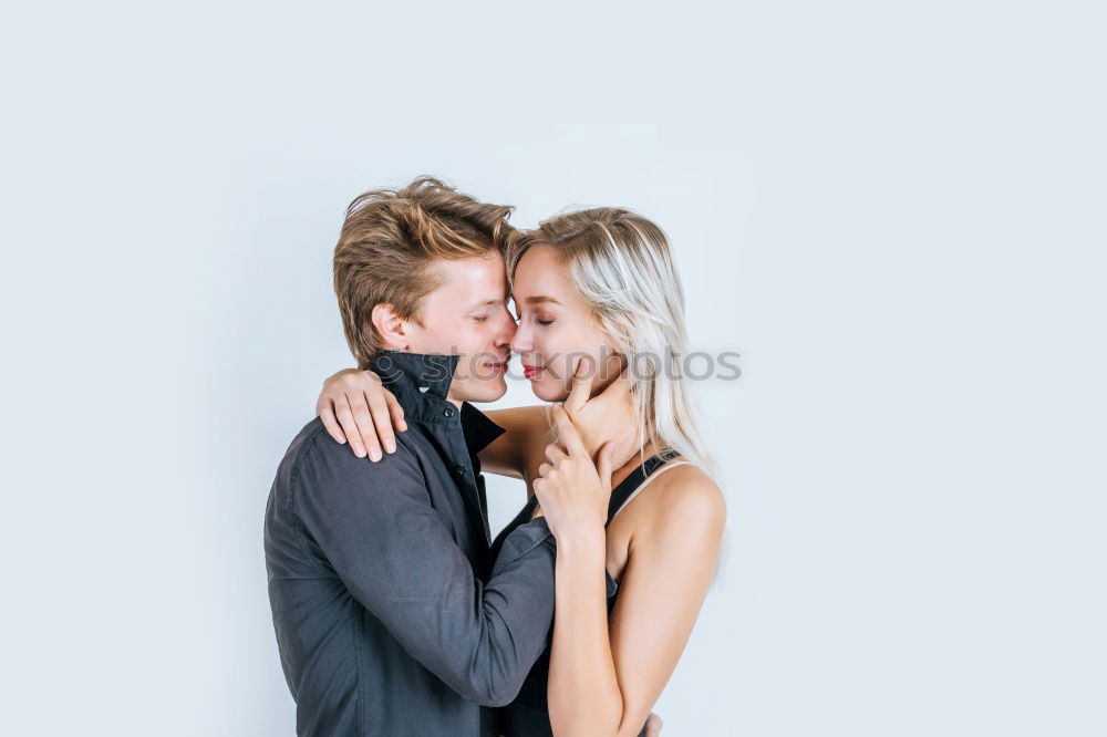 Similar – Image, Stock Photo Blonde woman and bearded man embracing and smiling together with a van in the background at sunset.