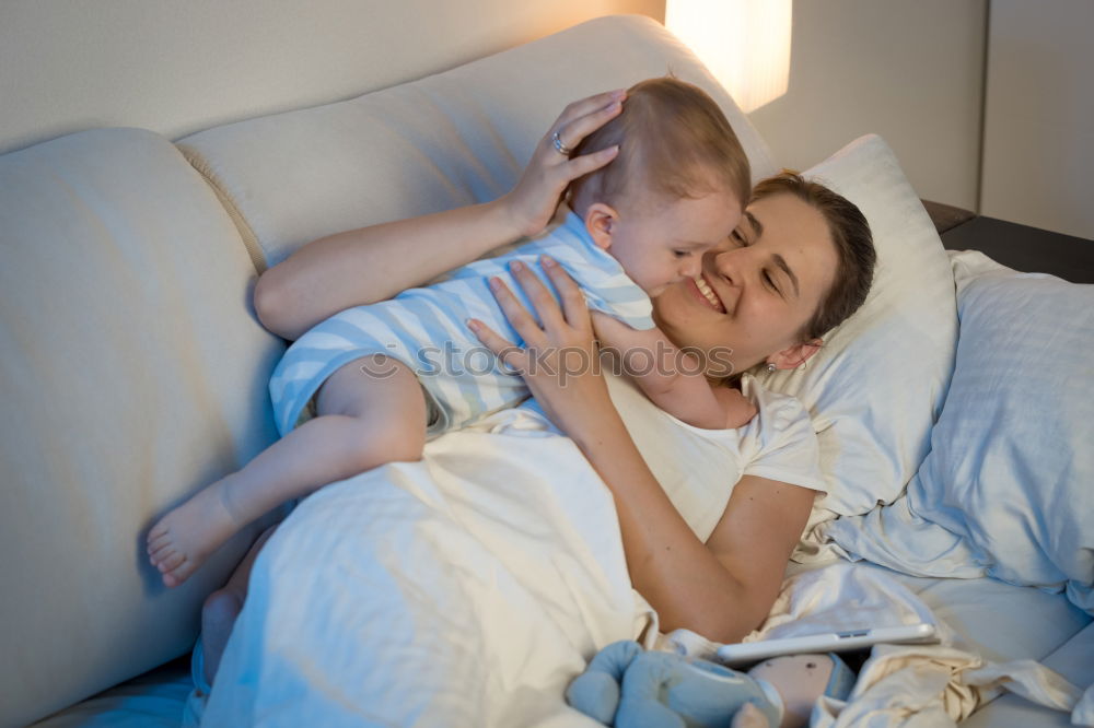 Similar – Brother and sister tickling and laughing on bed