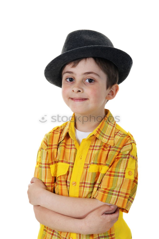 Portrait of a cute kid with hat in front of a ocean