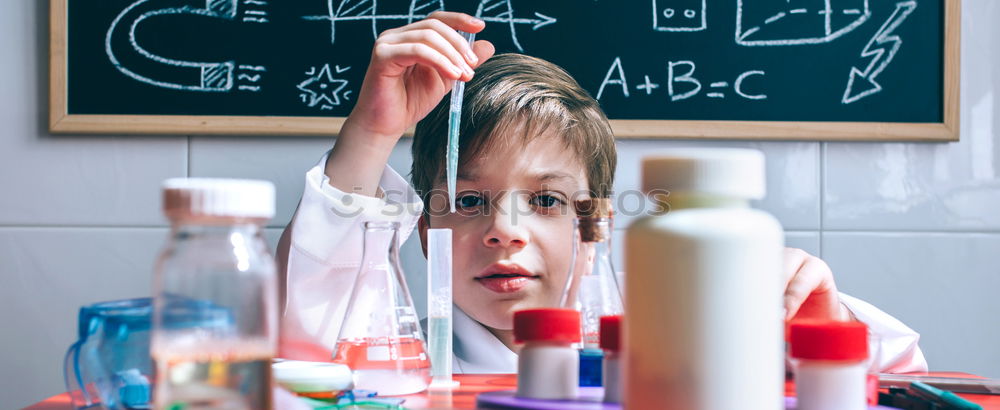 Similar – Child dressed as a scientist and chalkboard