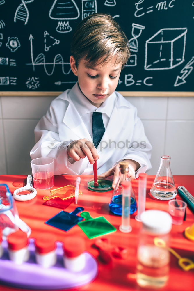 Similar – Image, Stock Photo Boy playing with chemistry game