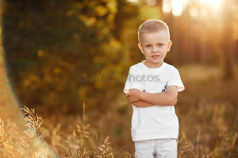 Similar – Image, Stock Photo smiling child sitting in field