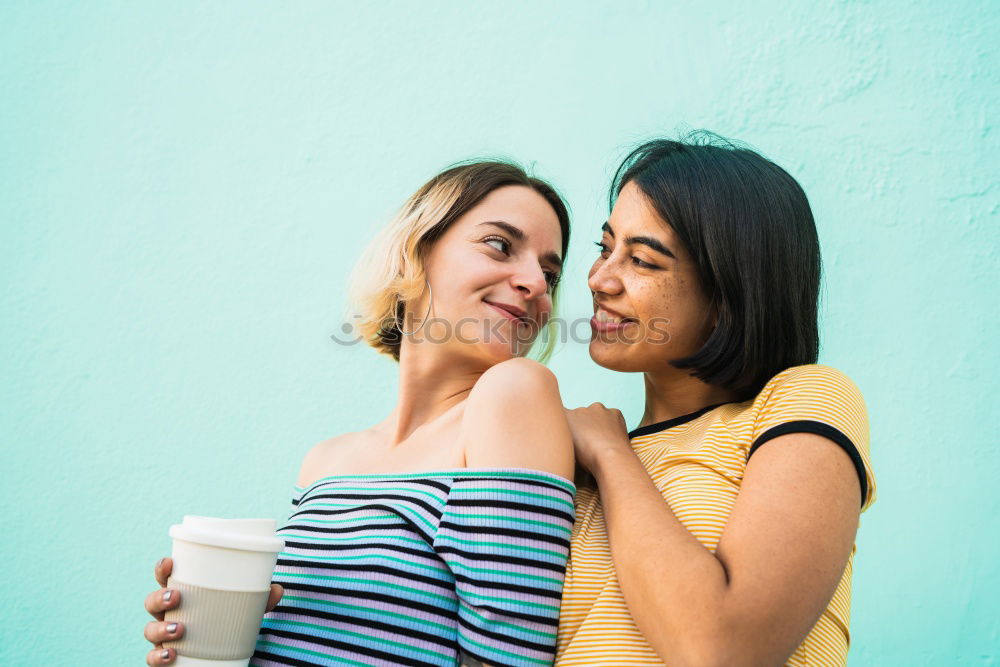 Similar – Happy friends sitting on steps