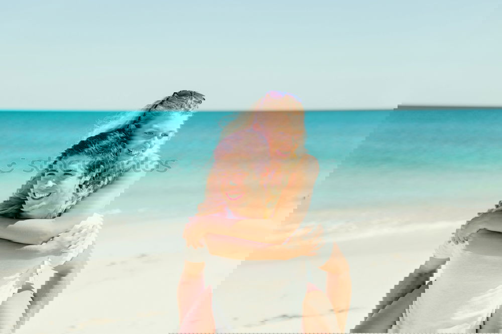 Similar – Image, Stock Photo Father and son playing on the beach at the day time. Concept of friendly family.