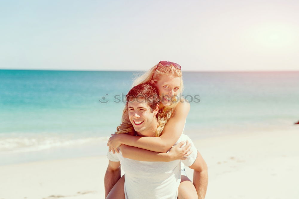 Similar – Father and daughter with balloons playing on the beach