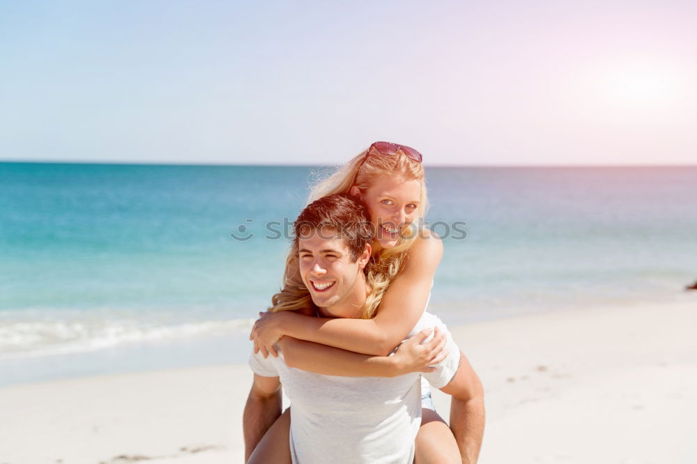 Similar – Father and daughter with balloons playing on the beach