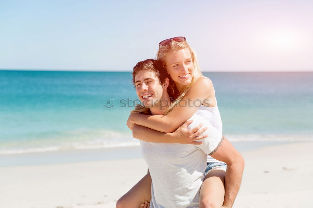 Similar – Father and daughter with balloons playing on the beach