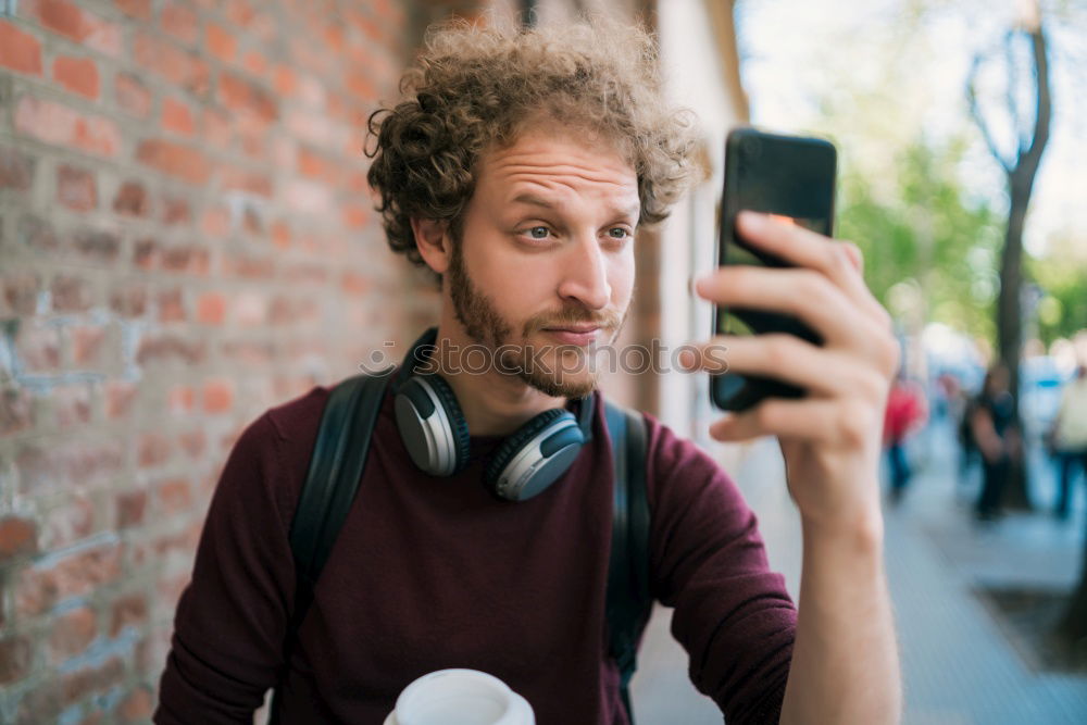 Similar – Image, Stock Photo Handsome man posing on orange wall