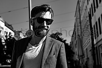 Similar – Image, Stock Photo Young handsome man over a dark brick wall