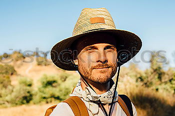 Similar – Hunter is happy about his prey he shot in wilderness and smiling