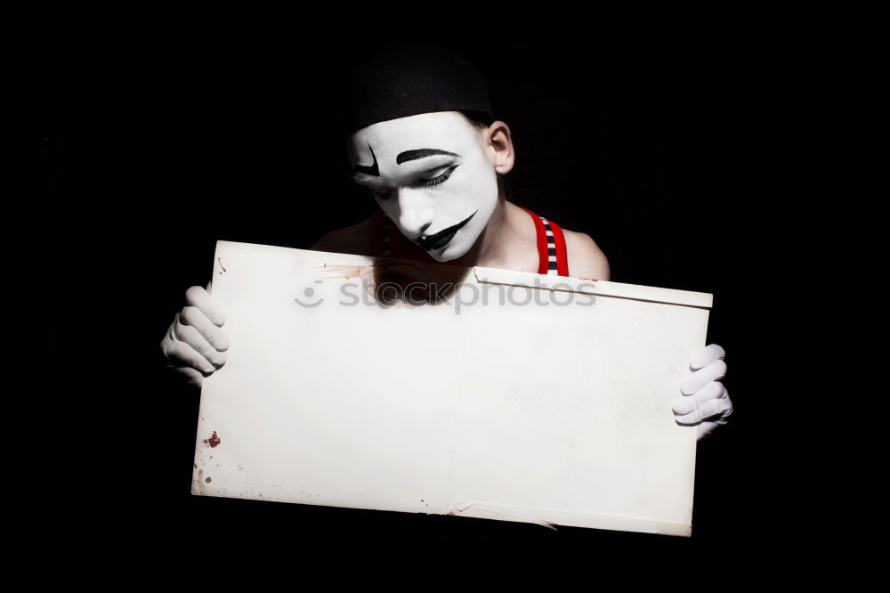 Similar – man is holding a creepy Mask