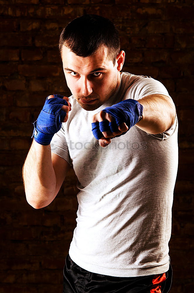 Similar – Image, Stock Photo Young thai boxing man is doing a workout for fight