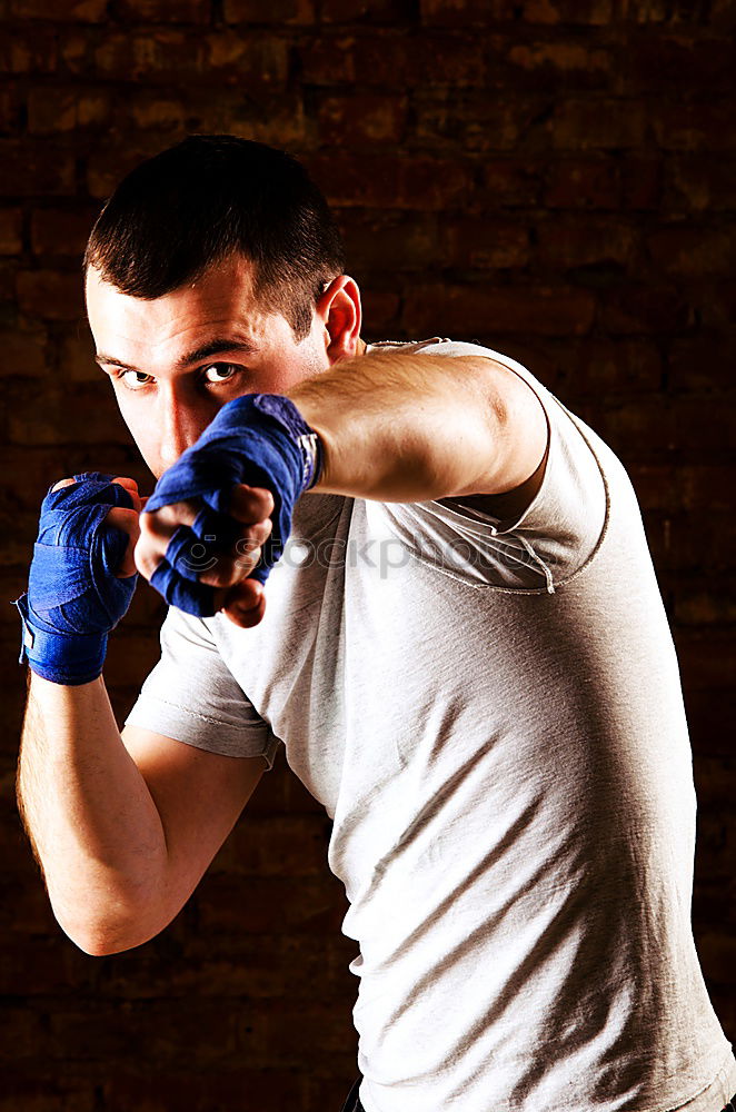 Similar – Image, Stock Photo Young thai boxing man is doing a workout for fight