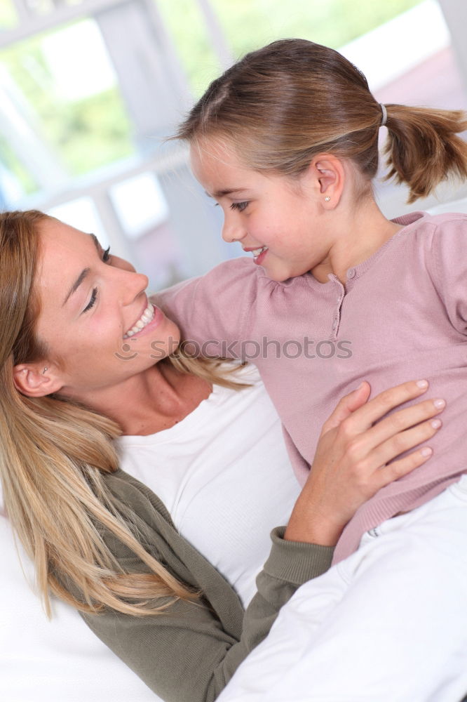 Similar – Image, Stock Photo Mother and daughter smiling and hugging outdoors