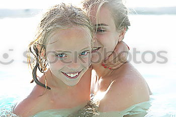 Similar – Image, Stock Photo Three happy children playing on the swimming pool at the day time. People having fun outdoors. Concept of friendly siblings.